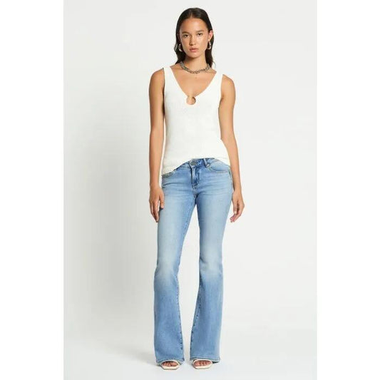 Image of a model wearing Denim. Productname: Vintage Low Rise Bootleg Jean in Washed Indigo colour by brand - sass and bide
