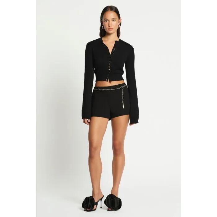 Image of a model wearing Outerwear. Productname: Modi Shrunken Cardi in NOIR colour by brand - sass and bide