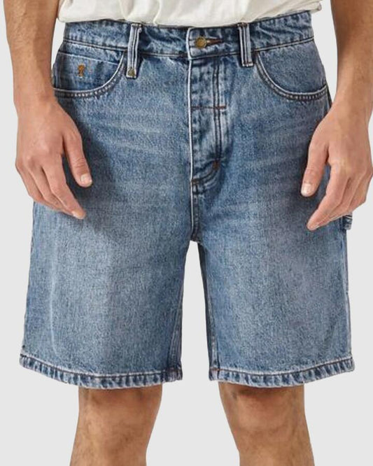 Image of a model wearing Shorts. Productname: Thrills Mens Slacker Denim Shorts Weathered Blue - in Weathered Blue colour by brand - Thrills