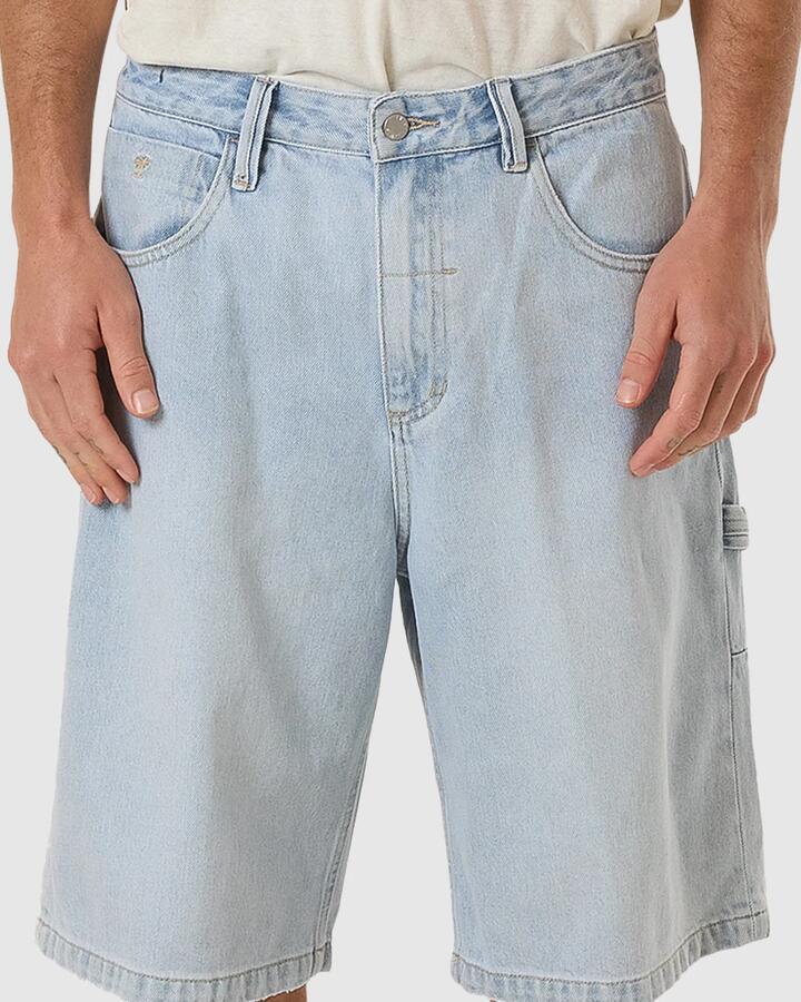 Image of a model wearing Shorts. Productname: Thrills Mens Big Slacker Denim Shorts Ether Blue - in Ether Blue colour by brand - Thrills