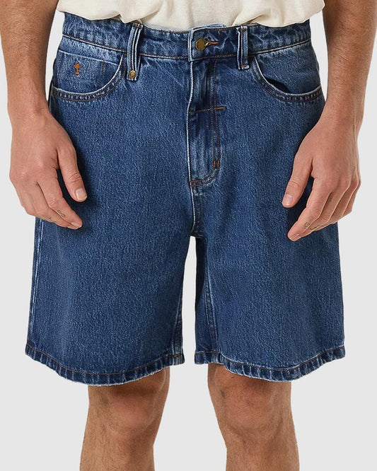 Image of a model wearing Shorts. Productname: Thrills Mens Slacker Denim Shorts Double Rinsed Blues - in Double Rinsed Blues colour by brand - Thrills