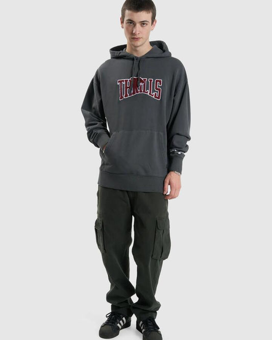 Image of a model wearing Outerwear. Productname: Thrills Mens Stand Firm Slouch Pullover Hoodie Merch Black - in Merch Black colour by brand - Thrills