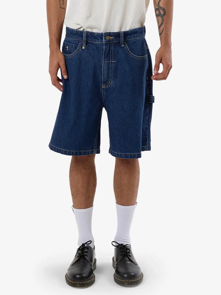 Image of a model wearing Shorts. Productname: Thrills Mens Slacker Denim Shorts Union Blue - in Union Blue colour by brand - Thrills