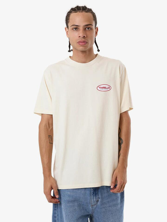 Image of a model wearing Tops. Productname: Thrills Mens Tribute To Chaos Merch Fit T-Shirt Heritage White - in Heritage White colour by brand - Thrills