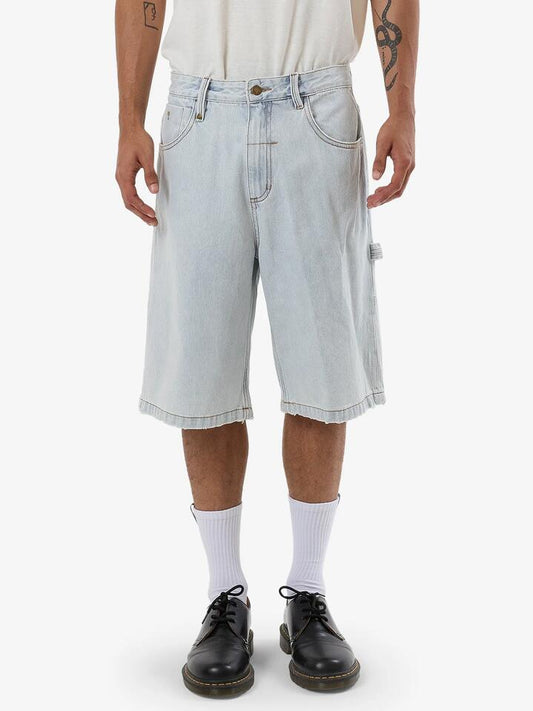 Image of a model wearing Shorts. Product name - Thrills Mens Big Slacker Denim Shorts Dirty Fade in Dirty Fade colour by brand - Thrills