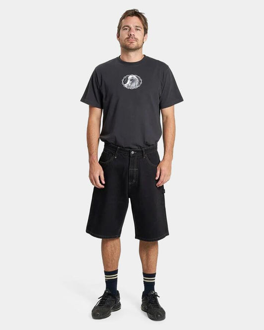 Image of a model wearing Shorts. Productname: Thrills Mens Big Slacker Denim Shorts Black Rinse - in Black Rinse colour by brand - Thrills