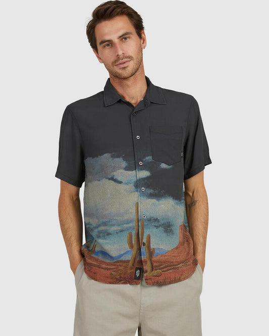 Image of a model wearing Tops. Productname: Thrills Mens Monumenstal Thrills Short Sleeve Shirt Black - in Black colour by brand - Thrills