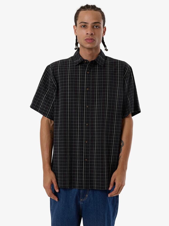 Image of a model wearing Tops. Productname: Thrills Mens Lockstar Short Sleeve Shirt Black - in Black colour by brand - Thrills