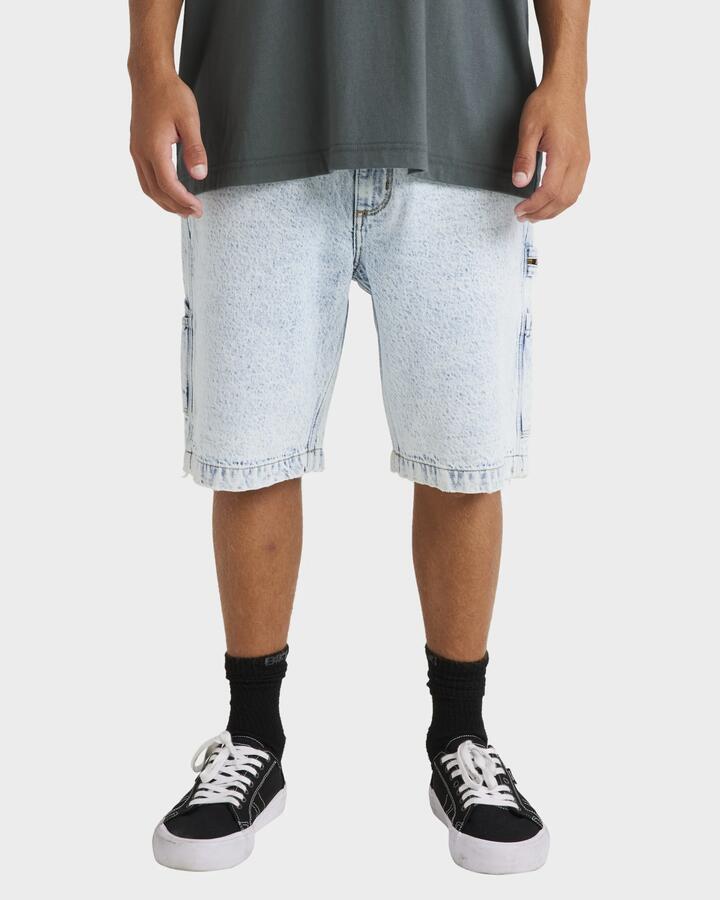 Image of a model wearing Shorts. Product name - Billabong Mens Bad Dog Workwear Denim Shorts Stone Blue in Stone Blue colour by brand - Billabong