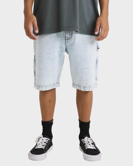Image of a model wearing Shorts. Product name - Billabong Mens Bad Dog Workwear Denim Shorts Stone Blue in Stone Blue colour by brand - Billabong