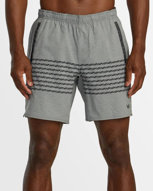 Image of a model wearing Shorts. Productname: RVCA - Mens Yogger Strech Athletic Shorts - Heather Grey Va Band - in Heather Grey Va Band colour by brand - RVCA