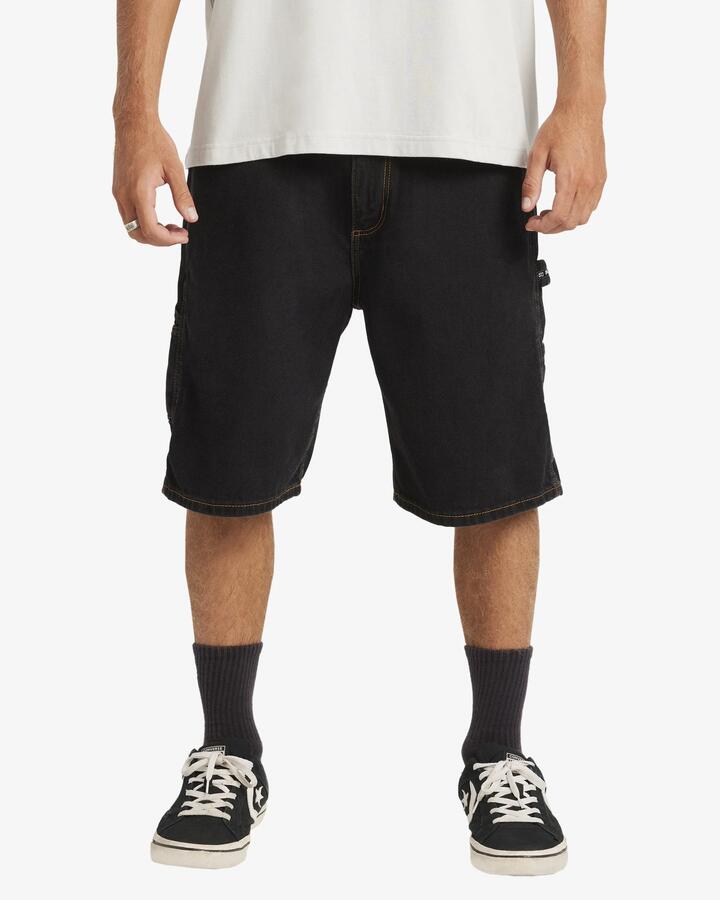 Image of a model wearing Shorts. Product name - Billabong Mens Bad Dog Workwear Denim Shorts Washed Black in Washed Black colour by brand - Billabong