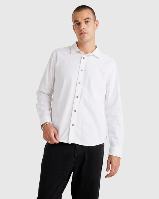 Image of a model wearing Tops. Productname: RVCA - Mens Base Linen Long Sleeve Top - White - in White colour by brand - RVCA