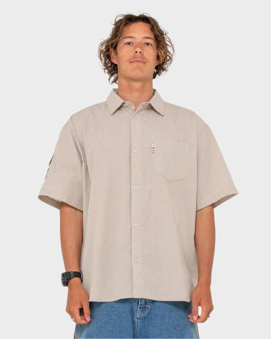 Image of a model wearing Tops. Productname: Rusty Mens Stasha Pocket Short Sleeve Shirt Light Khaki - in Light Khaki colour by brand - Rusty