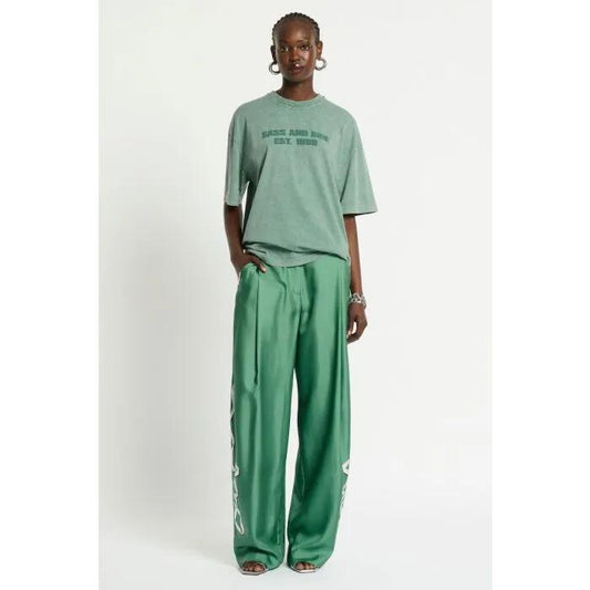 Image of a model wearing Pants. Productname: Revue Silk Pant in THYME GREEN colour by brand - sass and bide