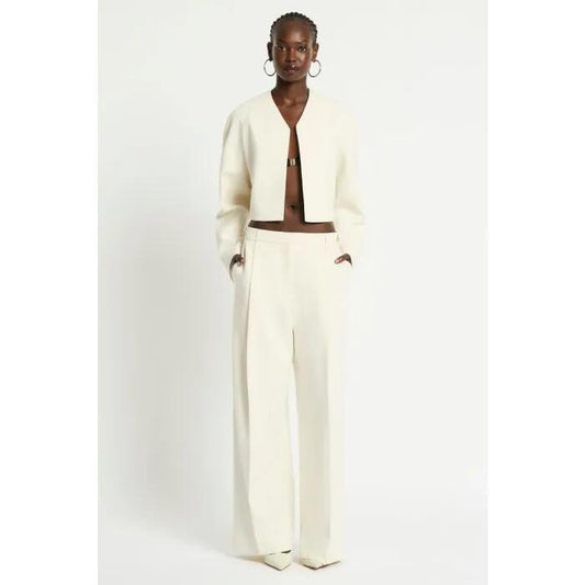 Image of a model wearing Pants. Productname: Satori Pant in Ivory colour by brand - sass and bide