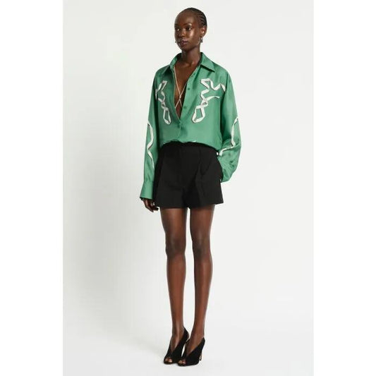 Image of a model wearing Tops. Productname: Revue Silk Shirt in THYME GREEN colour by brand - sass and bide