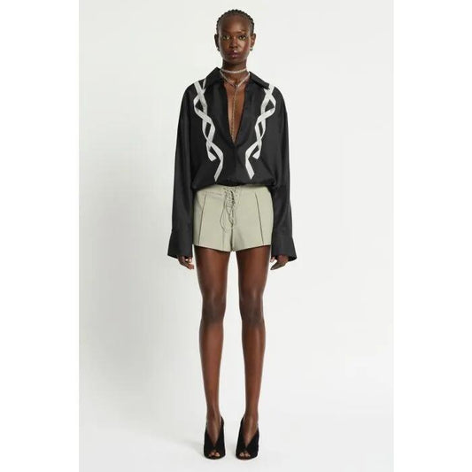 Image of a model wearing Tops. Productname: Revue Silk Shirt in JET BLACK colour by brand - sass and bide