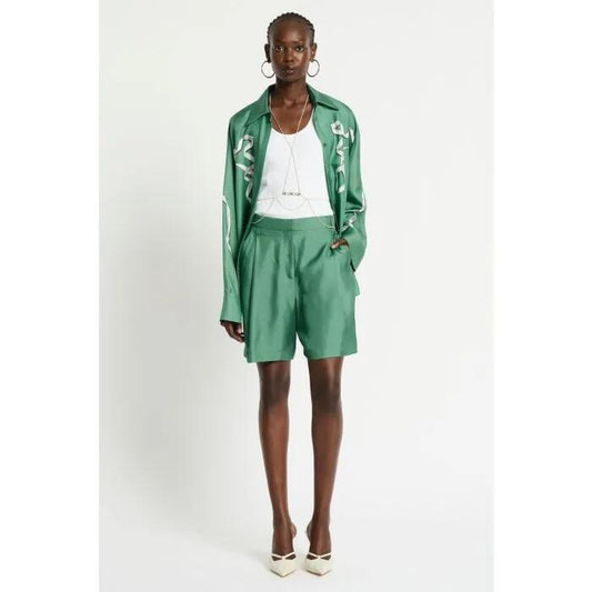 Image of a model wearing Shorts. Productname: Revue Silk Short in THYME GREEN colour by brand - sass and bide