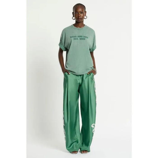 Image of a model wearing Tops. Productname: Rue Logo Tee in MOSS GREEN WASHED colour by brand - sass and bide