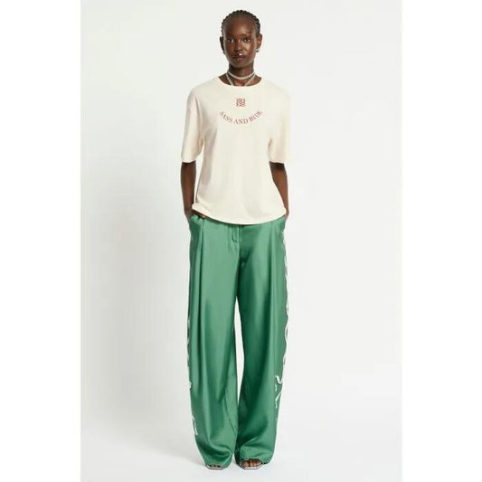 Image of a model wearing Tops. Productname: Essence Tee in Cream colour by brand - sass and bide