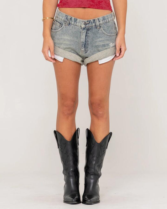 Image of a model wearing Shorts. Productname: Rusty Womens X-Tina Phoenix Low Rise Denim Shorts Dirty Dawg - in Dirty Dawg colour by brand - Rusty