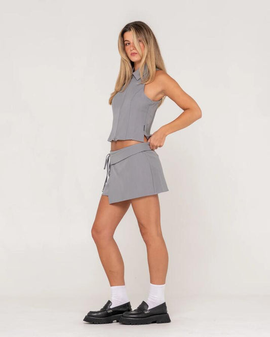Image of a model wearing Skirts. Productname: Rusty - Womens Biznez Milos Low Rise Mini Skirt - Oyster Grey - in Oyster Grey colour by brand - Rusty