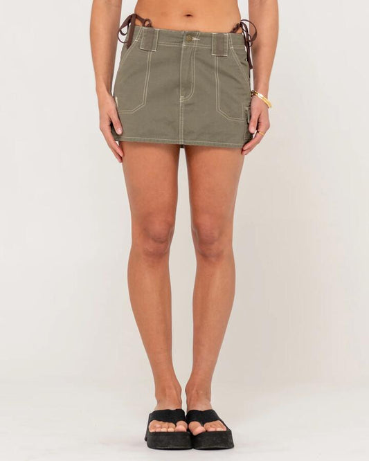 Image of a model wearing Skirts. Productname: Rusty Womens Dirtbag Cargo Low Rise Mini Skirt Light Khaki - in Light Khaki colour by brand - Rusty