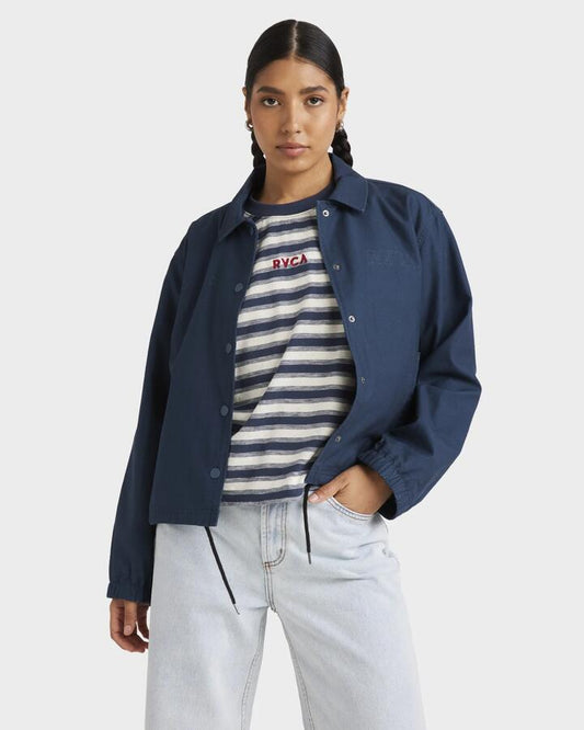 Image of a model wearing Outerwear. Productname: RVCA Womens Twill Coaches Jacket Petrol Blue - in Petrol Blue colour by brand - RVCA