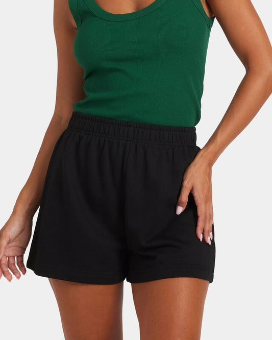 Image of a model wearing Outerwear. Productname: Nunui Womens Archer Fleece Shorts Black - in Black colour by brand - Nunui