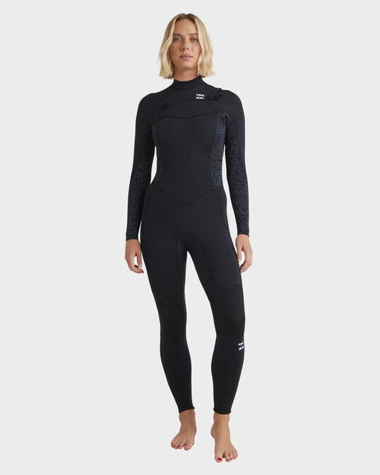 Image of a model wearing Tops. Productname: Billabong Womens 4/3Mm Synergy Natural Chest Zip Steamer Wetsuit Black Fade - in Black Fade colour by brand - Billabong