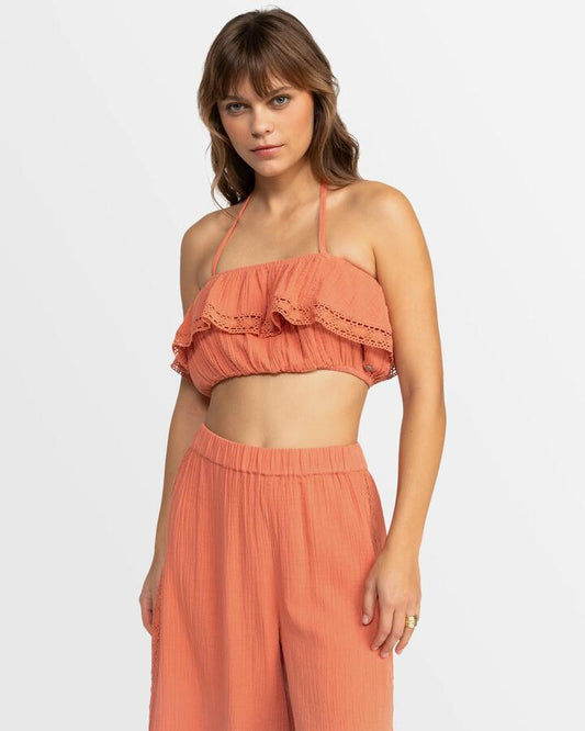 Image of a model wearing Tops. Productname: Roxy Womens Golden Tropic Halter Top Apricot Brandy - in Apricot Brandy colour by brand - Roxy
