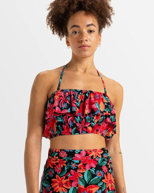 Image of a model wearing Tops. Productname: Roxy Womens Golden Tropic Printed Halter Top Anthracite Floral Fiesta Big - in Anthracite Floral Fiesta Big colour by brand - Roxy