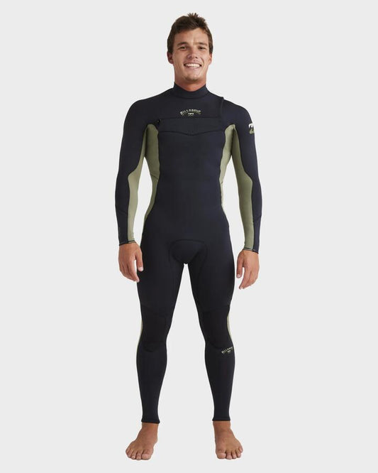 Image of a model wearing Tops. Productname: Billabong - Mens 3/2Mm Absolute Natural Chest Zip Steamer Wetsuit - Military - in Military colour by brand - Billabong