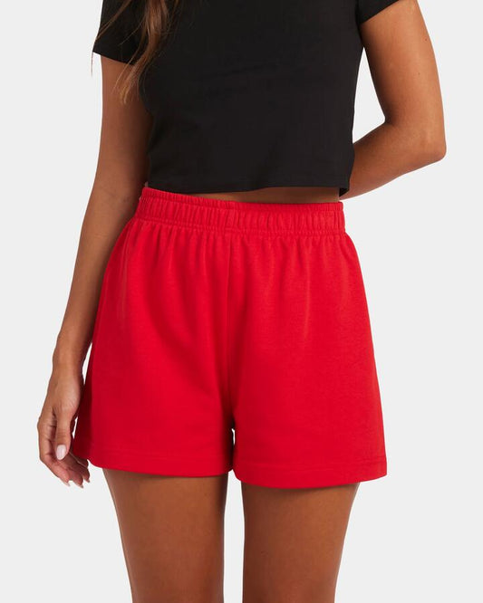 Image of a model wearing Outerwear. Productname: Nunui Womens Archer Fleece Shorts Red - in Red colour by brand - Nunui