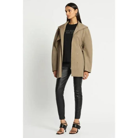 Image of a model wearing Outerwear. Productname: Monologue Trench Coat in MUSHROOM colour by brand - sass and bide