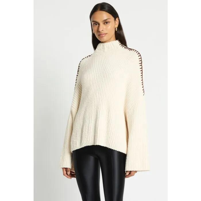 Image of a model wearing Outerwear. Productname: Alaska Knit Jumper in FULL CREAM colour by brand - sass and bide