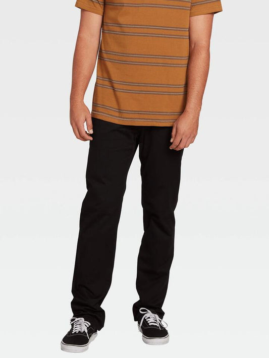 Image of a model wearing Pants. Productname: Volcom Mens Solver Lite 5 Pocket Pants Black - in Black colour by brand - Volcom
