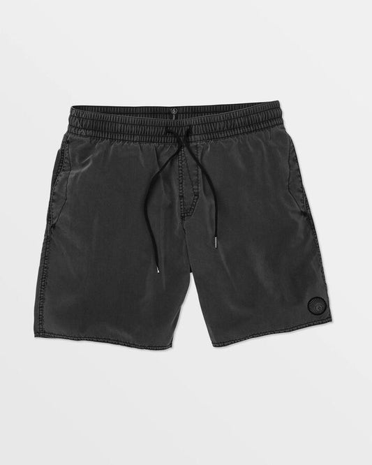 Image of a model wearing Shorts. Productname: Volcom - Mens Center Trunk 17" Swim Shorts - Black - in Black colour by brand - Volcom