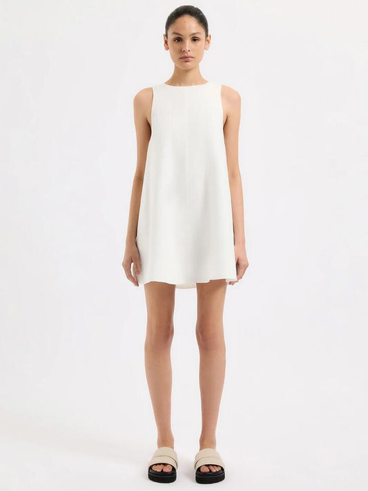Image of a model wearing Dress. Productname: Nude Lucy Nemi Linen Dress in White colour by brand - Nude Lucy