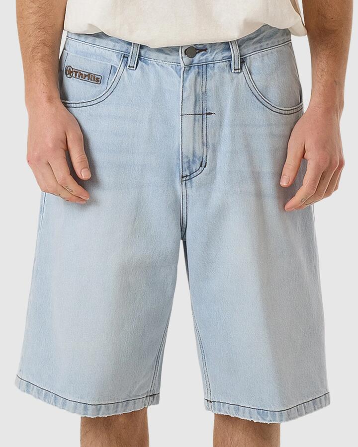 Image of a model wearing Shorts. Product name - Thrills Mens Gazed Big Slacker Denim Shorts Gazed Blue in Gazed Blue colour by brand - Thrills