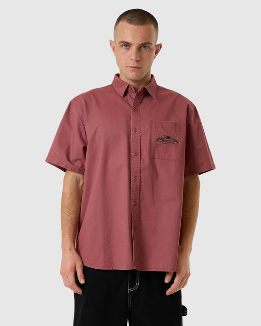 Image of a model wearing Tops. Productname: Thrills - Mens Deadly Garden Short Sleeve Shirt - Hawthorn Rose - in Hawthorn Rose colour by brand - Thrills