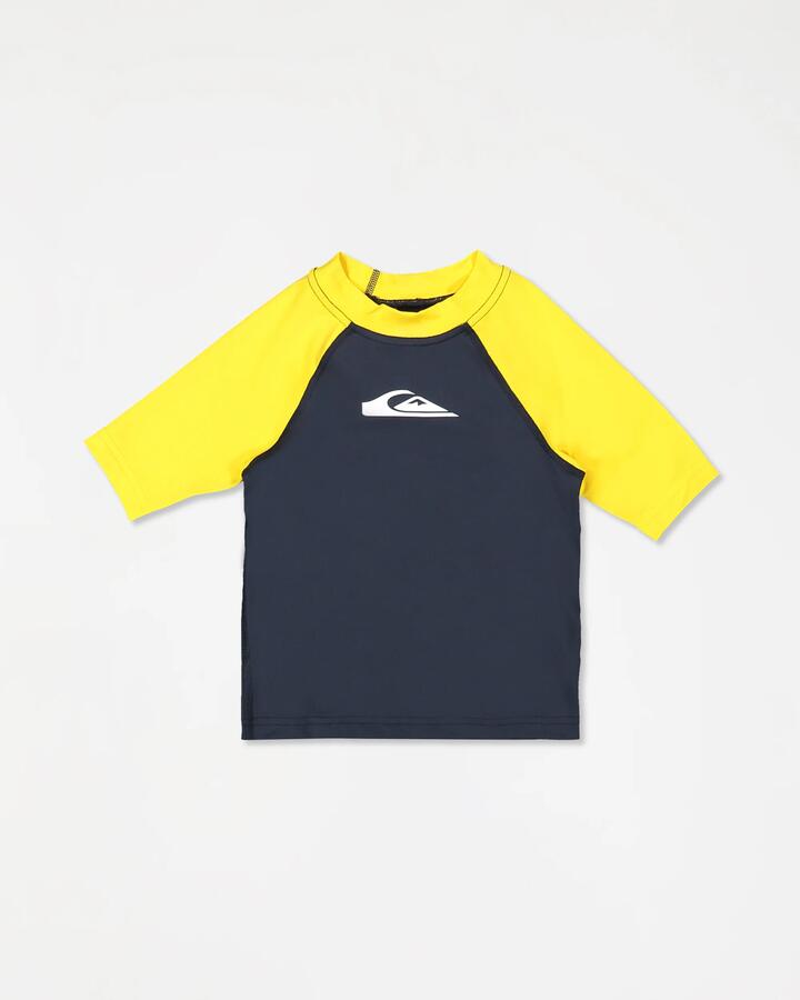 Image of a model wearing Tops. Product name - Quiksilver Boys 2-7 Everyday Short Sleeve Upf 50 Surf T-Shirt Dark Navy/Solar Power in Dark Navy/Solar Power colour by brand - Quiksilver