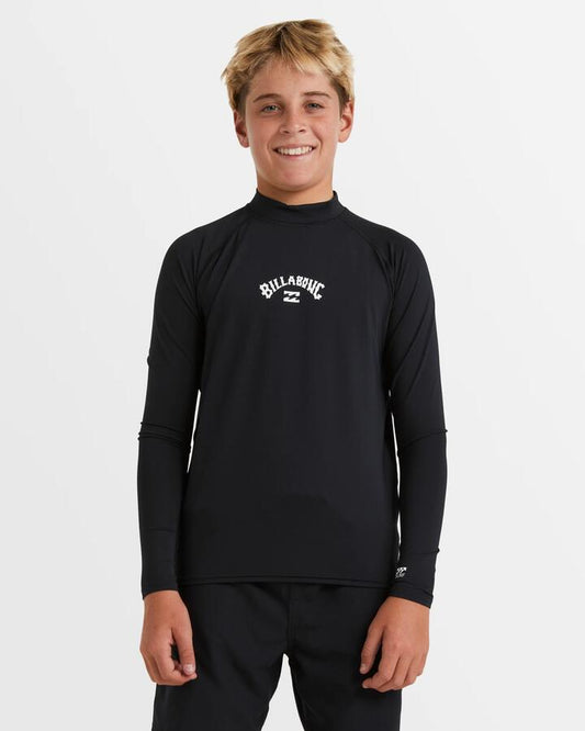 Image of a model wearing Tops. Productname: Billabong Boys 8-16 All Day Arch Long Sleeve Rash Vest Black - in Black colour by brand - Billabong