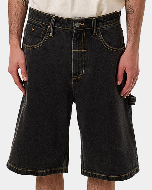 Image of a model wearing Shorts. Productname: Thrills Mens Big Slacker Denim Shorts Black - in Black colour by brand - Thrills