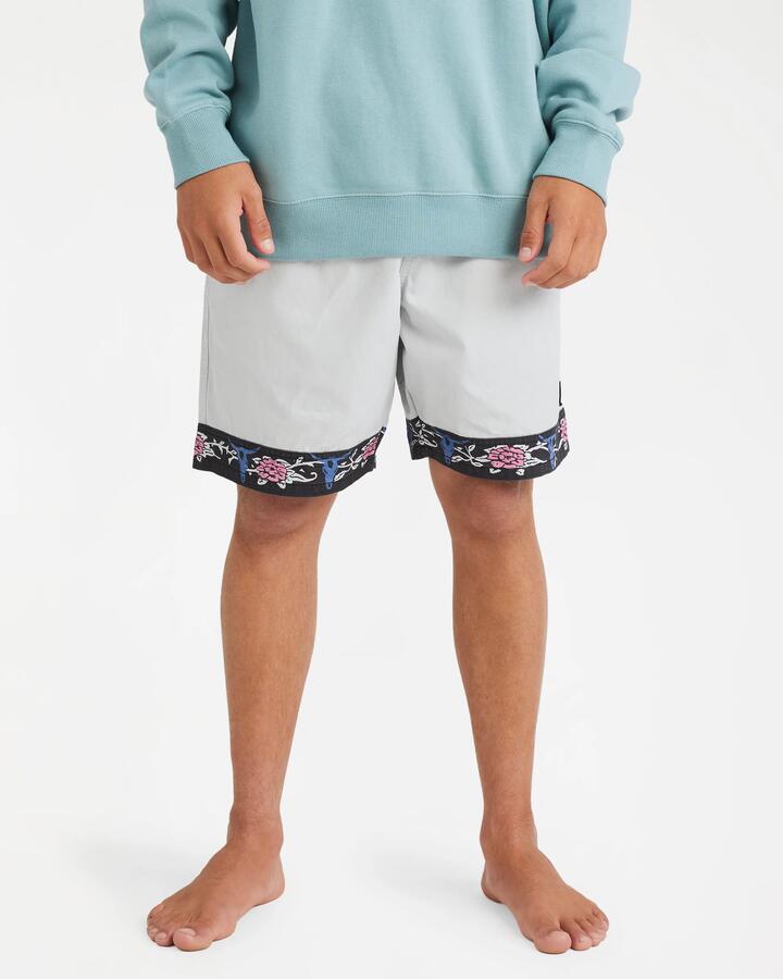 Image of a model wearing Shorts. Product name - Billabong Mens Occy 17" Elastic Waist Shorts Silver - in Silver colour by brand - Billabong