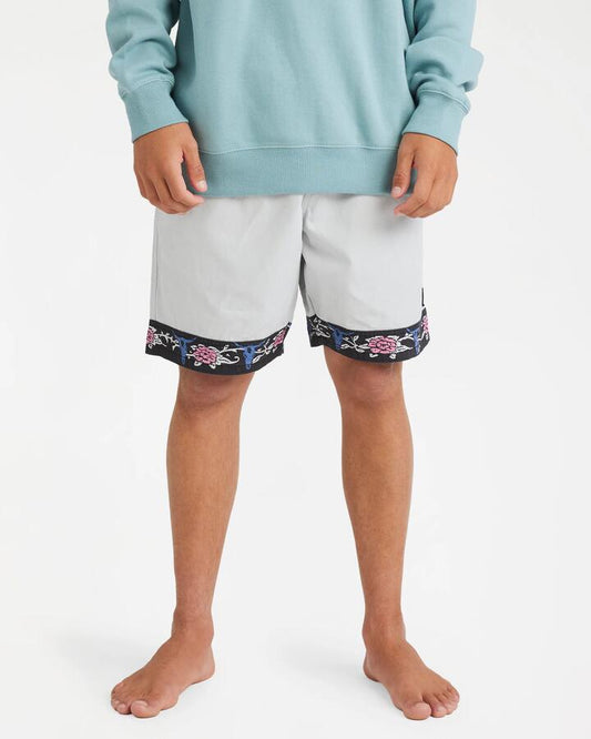 Image of a model wearing Shorts. Product name - Billabong Mens Occy 17" Elastic Waist Shorts Silver - in Silver colour by brand - Billabong