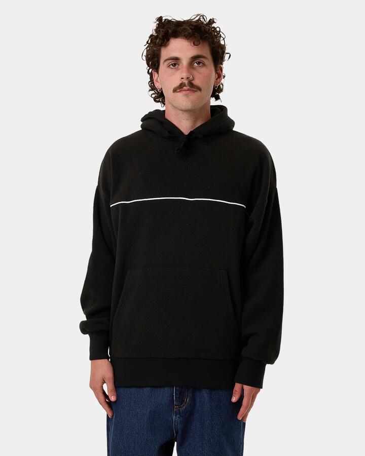 Image of a model wearing Outerwear. Product name - Thrills Mens Hazed Slouch Polar Fleece Pulover Hoodie Black in Black colour by brand - Thrills