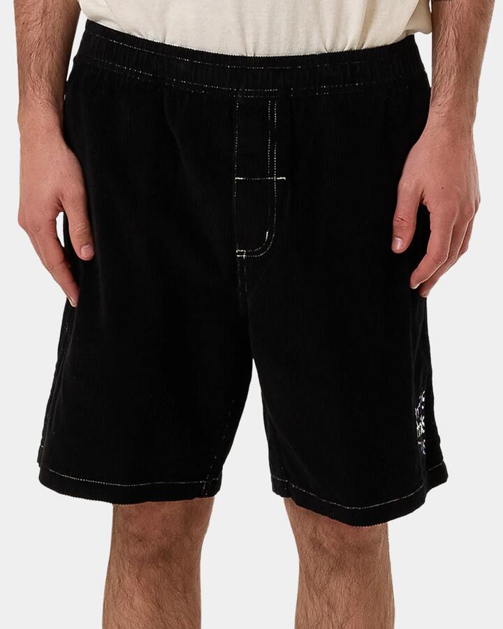 Image of a model wearing Shorts. Productname: Thrills Mens Relay Your Eyes Volley Shorts Black - in Black colour by brand - Thrills