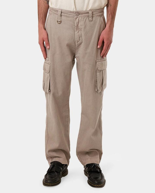 Image of a model wearing Pants. Productname: Thrills Mens Slacker Union Cargo Pants String - in String colour by brand - Thrills